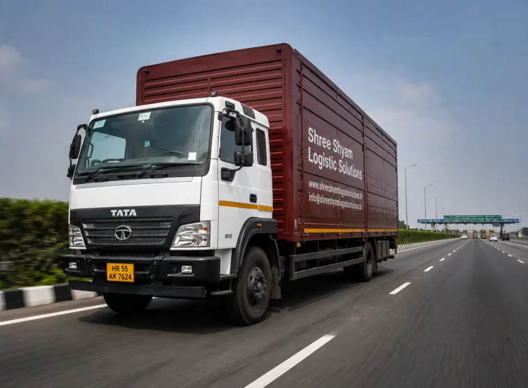 Enclosed car carrier truck of Shree Shyam Logistic Solutions loaded with secured cars in Gurgaon